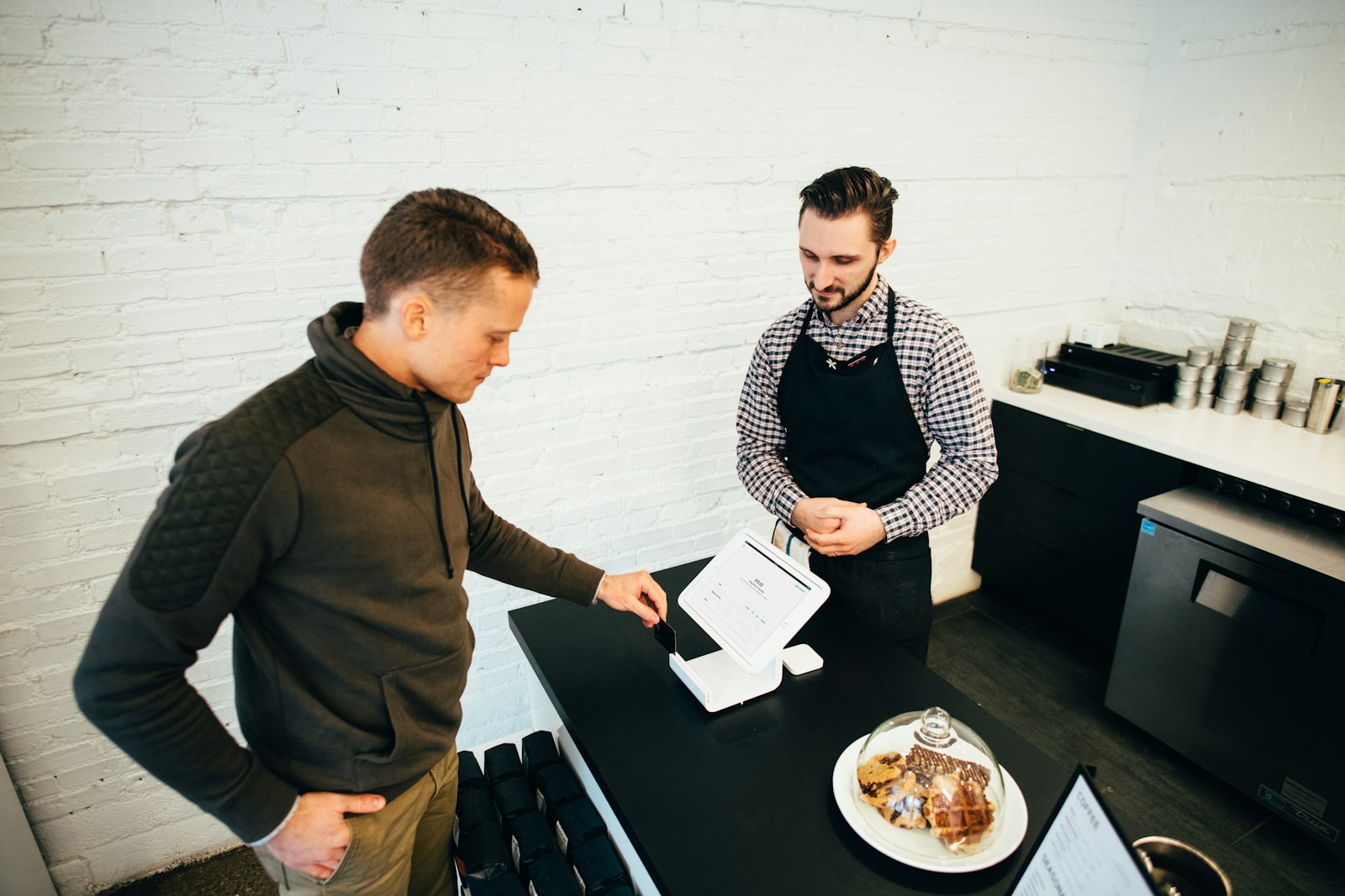 Remote hiring team reviewing applications on laptops