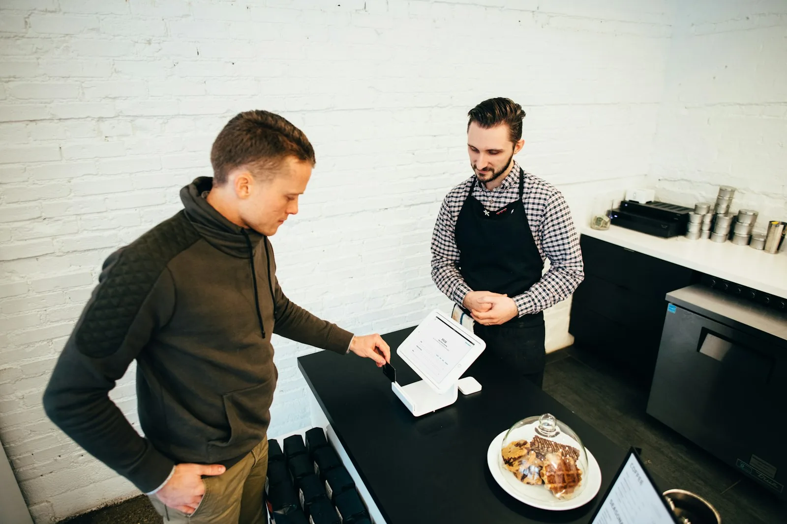 Remote hiring team reviewing applications on laptops