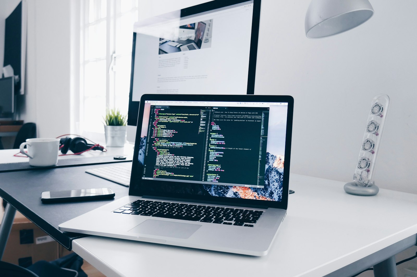 Designer reviewing digital portfolio at desk